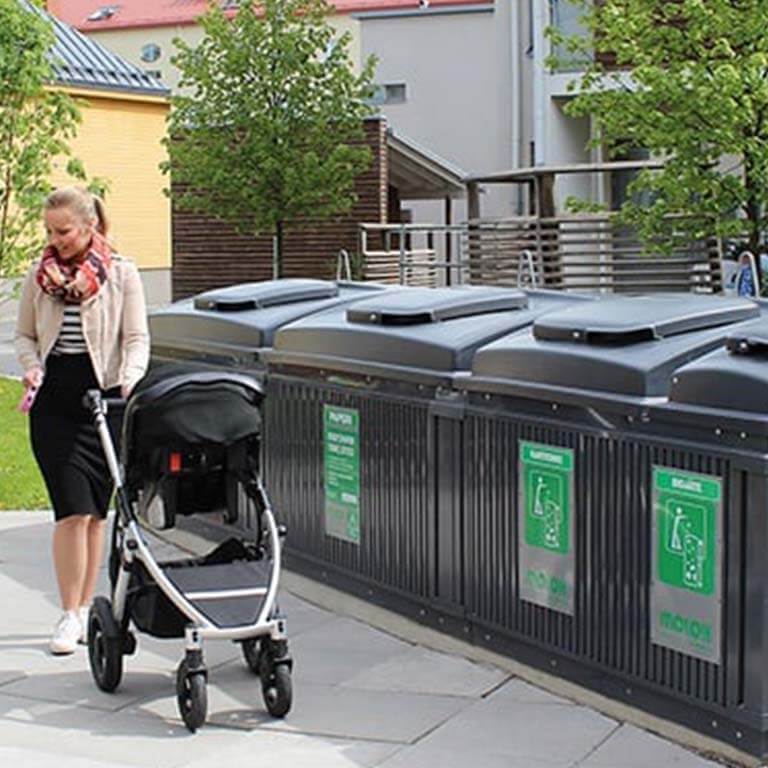 woman with pushchair using Molok bins