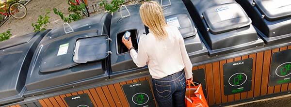 lady using a molok bin